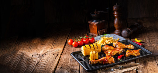 Rustic Grilled chicken wings,legs,and spicy corn