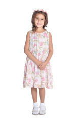 Happy little girl pointing up with finger isolated