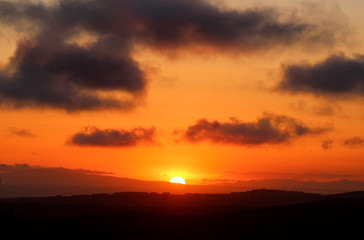 Fototapeta na wymiar Vivid orange sky at sunset over Laguna Beach California 