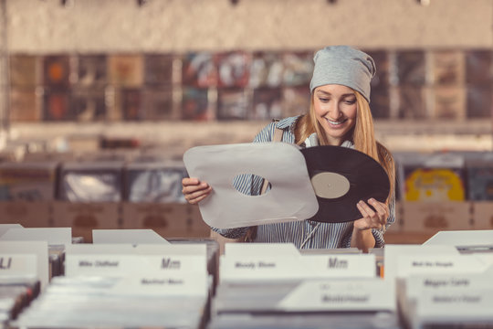 Smiling Girl In A Vinyl Record Store