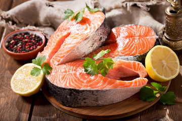 fresh salmon steaks with ingredients for cooking