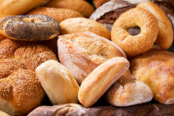Fototapeta na wymiar various types of fresh bread as background