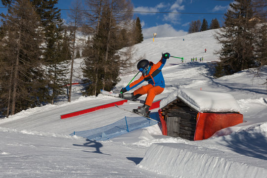 Skier in Action: Ski Jumping in the Mountain Snowpark