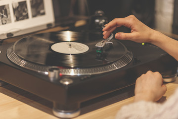 Female hands with a gramophone