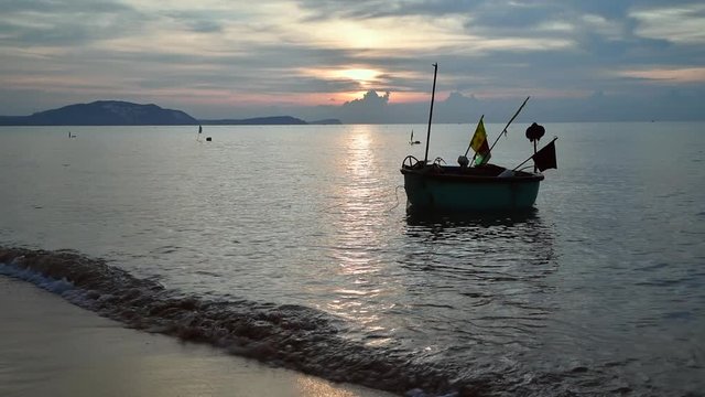 Local fishing boats in the sea with beautiful sky on morning at Phat Thiet, Mui Ne, Vietnam