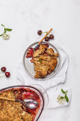 Summer berry crumble pie, light background, vegetarian breakfast, top view, copy space. Healthy vegan food concept.