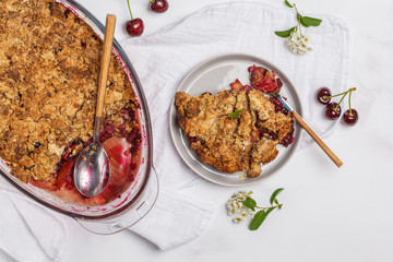 Summer berry crumble pie, light background, vegetarian breakfast, top view. Healthy vegan food concept.