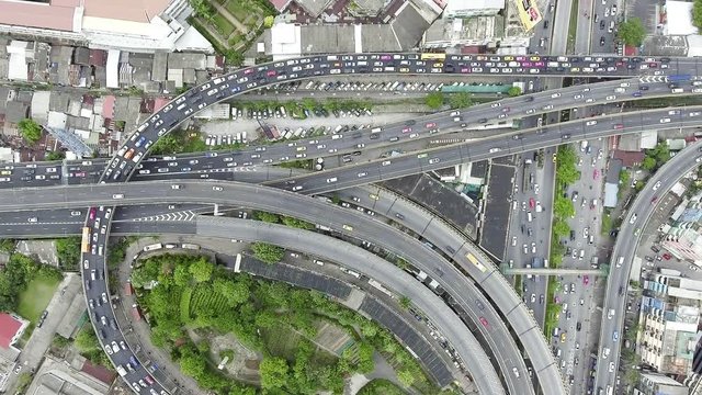 Aerial view of traffic jam in urban city. Top down view from up high. Afternoon day light shot. Congestion and urban life concept.