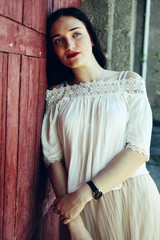 Fototapeta premium girl in beige tuxedo skirt and white blouse