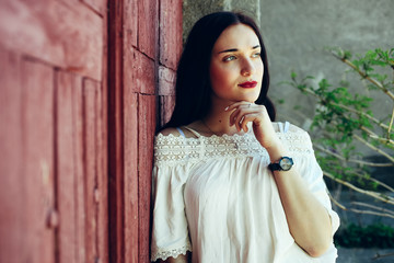 Fototapeta premium girl in beige tuxedo skirt and white blouse