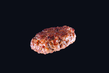 Fried fresh large beef burger isolated on white background. Grilled burger cutlet isolated on black