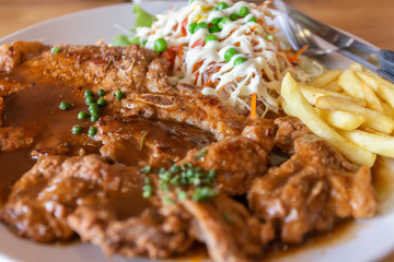 Grilled steak salad French fries on dish white