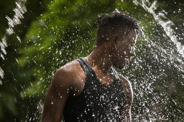 Fresh water splash pouring on a man, spa and health concept