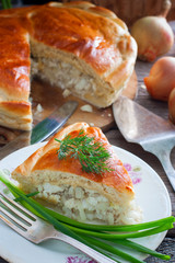 Closed yeast dough cake with fish, selective focus