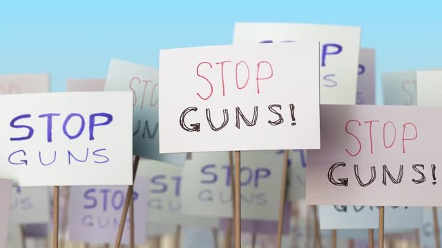 STOP GUNS placards at street demonstration. Conceptual loopable animation