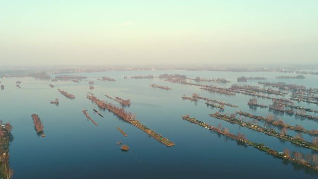 Aerial view of recreational harbour for small boats and bungalows on the lake at Loosdrecht Kalverstraat, the Netherlands.
