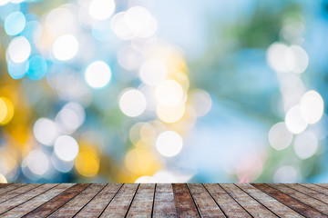 Empty wood table top on blur abstract nature background.