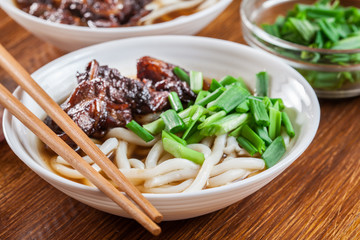 Japanese Udon noodles with beef, green onion and soup