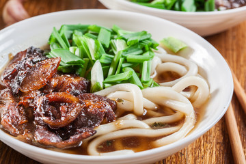 Japanese Udon noodles with beef, green onion and soup