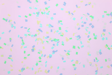 Table top view abstract colorful confetti party or birthday background concept.Flat lay objects pink paper with pastel tone creative design.free space for design text and contents.