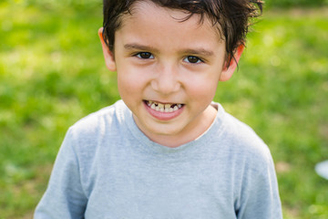 dark-haired boy in a forest