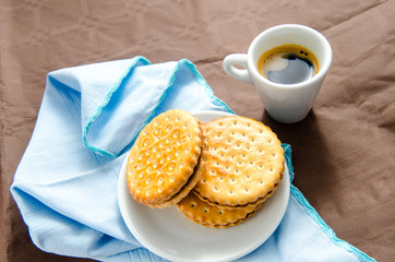 cup of coffee with biscuits