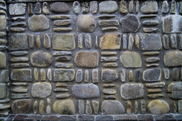 stone wall. texture of round colored stones