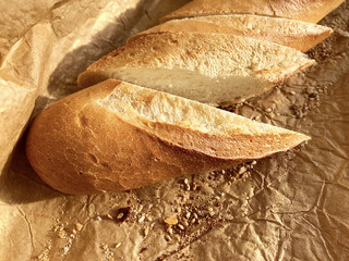 Bread with sesame seeds on a background of brown paper.