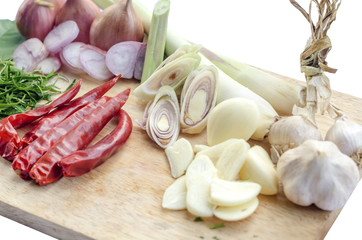 Shallots, lemongrass, with garlic and dry chili on Wooden cutting board on white background, Tom Yum