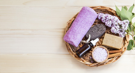Organic skincare and spa products with lilac flowers, bath salt and oil bottles , natural soap , home-spa setting still life, organic products for body and skin