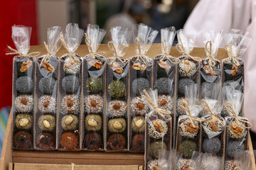 Beautiful home made candy, wrapped in a wrapper, on the counter of a street vendor.