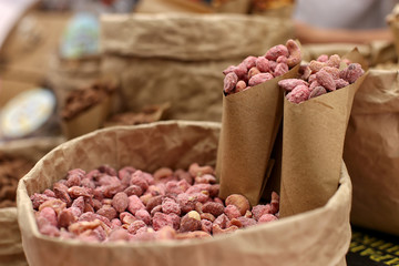 Nuts on the counter in kraft paper, an unusual super food.