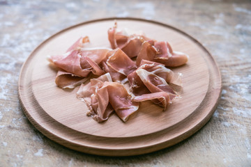 Italian jamon on  wooden  board