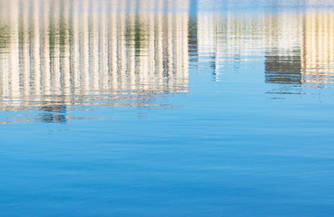 Fototapeta na wymiar Reflection of buildings in water
