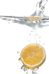 Fototapeta na wymiar lemon in water with bubbles