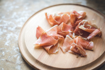 Jamon on wooden background