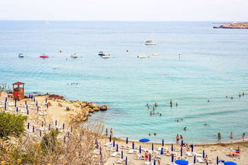 Daylight view from top to Konnos beach with people