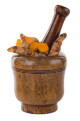 turmeric in wooden mortar isolated