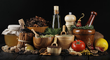 spices on black wooden background