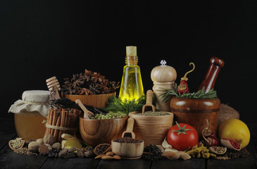 Fototapeta na wymiar spices on black wooden background