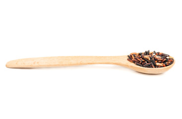 Black rice in a spoon
