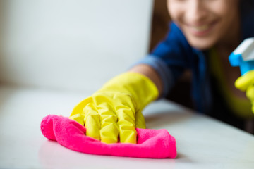 Close Up Photo of Woman Doing Housework. Housewife Portrait While Cleaning.