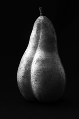 Erotic pear on a black background