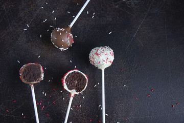 Cake pop on dark background, Copy space