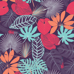 Seamless pattern from tropical leaves. multi-colored tropical leaves pattern