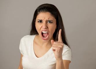 Human expressions and emotions. Young attractive woman with an angry face, looking furious and crazy