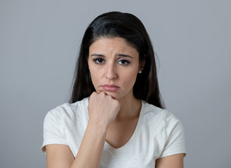 Human expressions, emotions. Young attractive woman with a depressed face, looking sad and unhappy