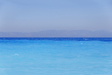 Obraz premium Tropical blue turquoise harmony sea gentle waves at the coast