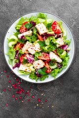 Meat salad with fresh vegetables. Vegetable salad with baked chicken breast. Vegetable salad with chicken fillet on plate
