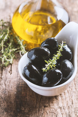 Bowl filled with fresh black olives